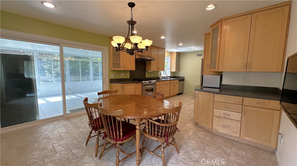 12111 Eddleston Drive Porter Ranch, CA 91326 - Photo 7 of 31 a view of a dining room with furniture window and outside view