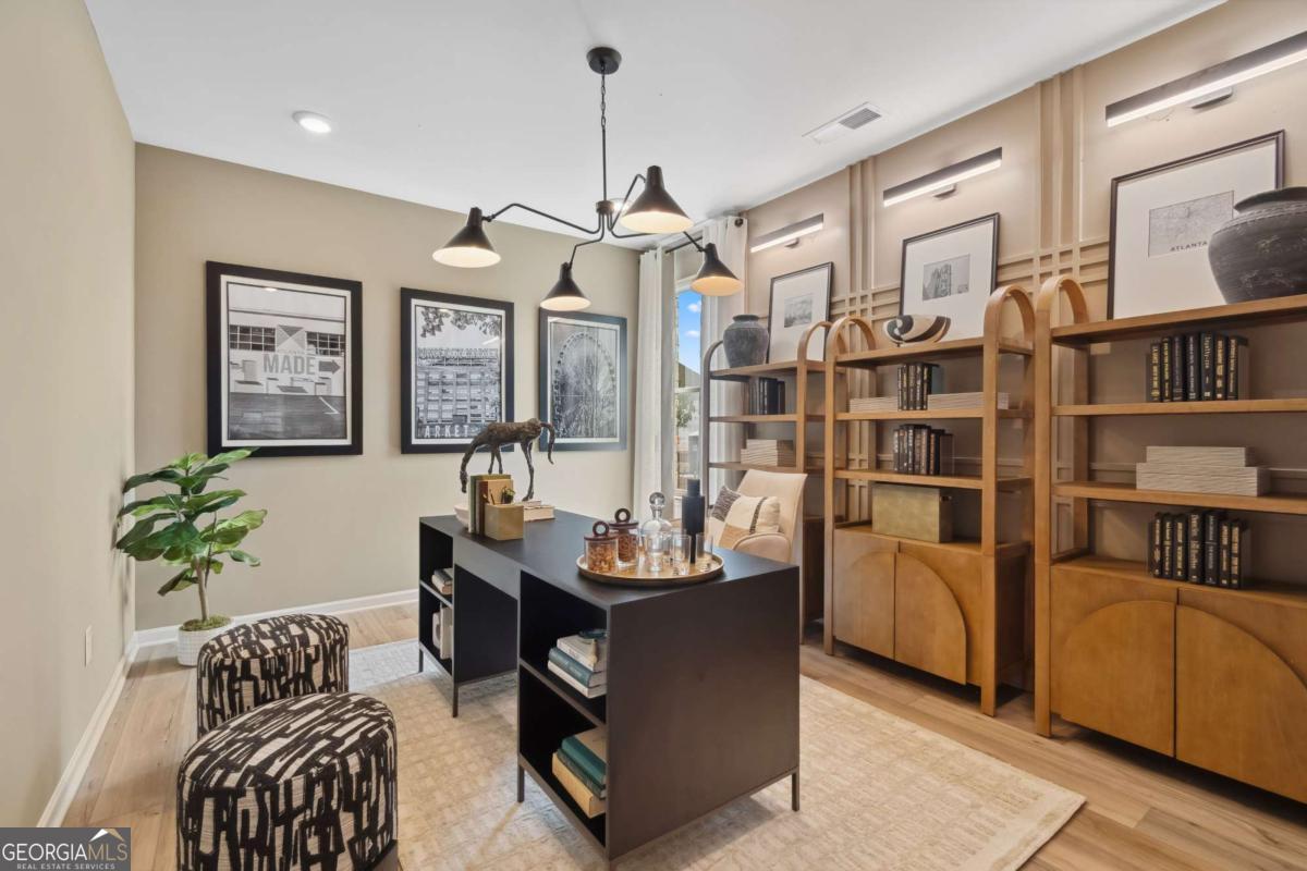 108 Compass Road Hampton, GA 30228 - Photo 24 of 51 a dining room with furniture and wooden floor