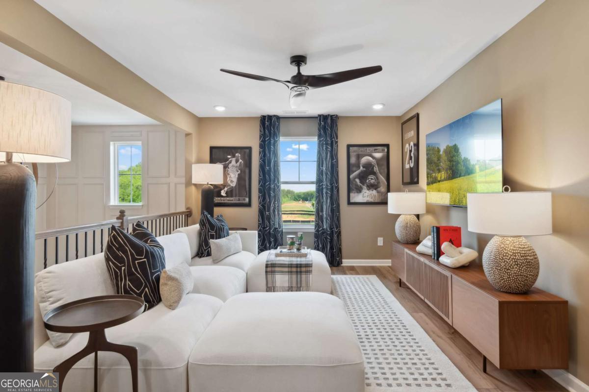 108 Compass Road Hampton, GA 30228 - Photo 34 of 51 a living room with furniture and a large window