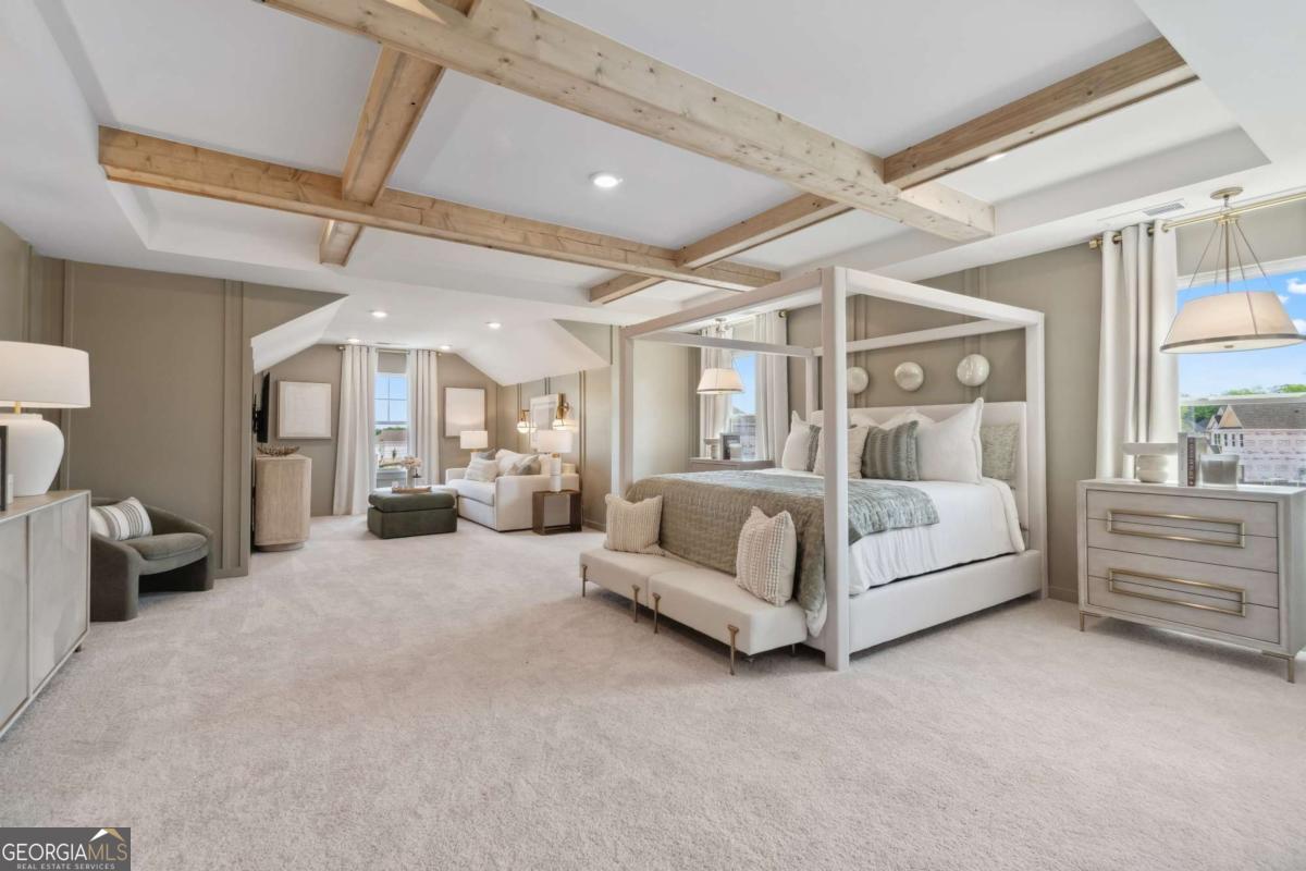 108 Compass Road Hampton, GA 30228 - Photo 36 of 51 a large white bed sitting in a room next to a lamp