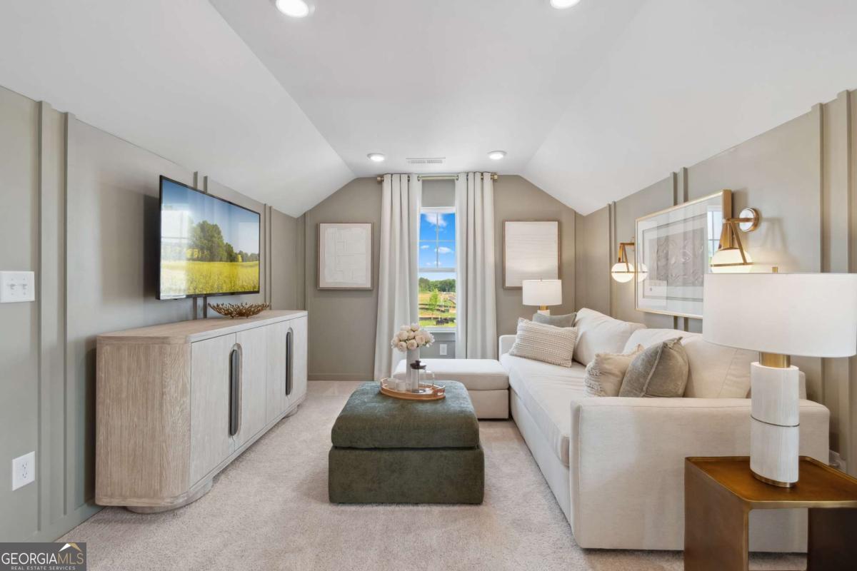 108 Compass Road Hampton, GA 30228 - Photo 37 of 51 a living room with furniture and a flat screen tv