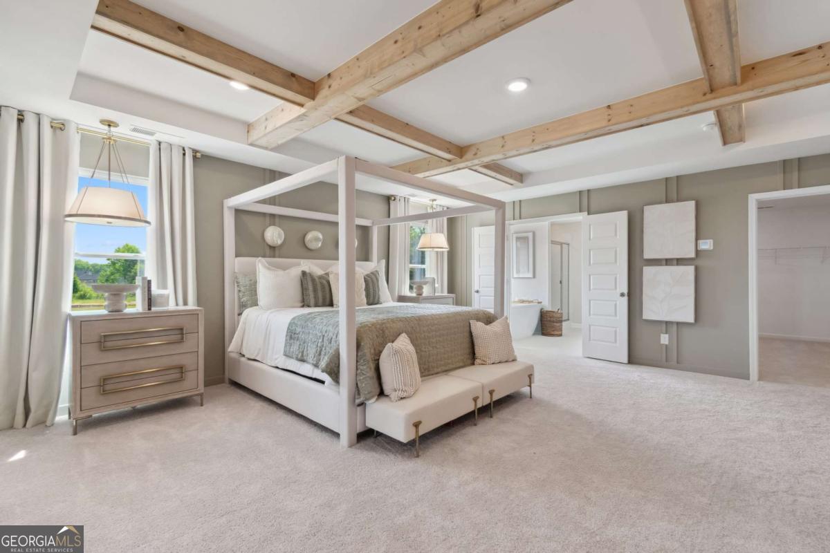 108 Compass Road Hampton, GA 30228 - Photo 38 of 51 a bed sitting in a spacious bedroom next to a window