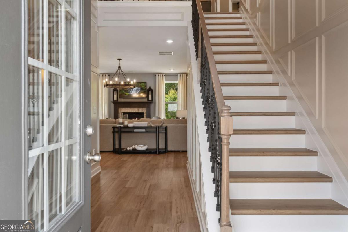 108 Compass Road Hampton, GA 30228 - Photo 4 of 51 a view of a hallway with wooden floor and entryway