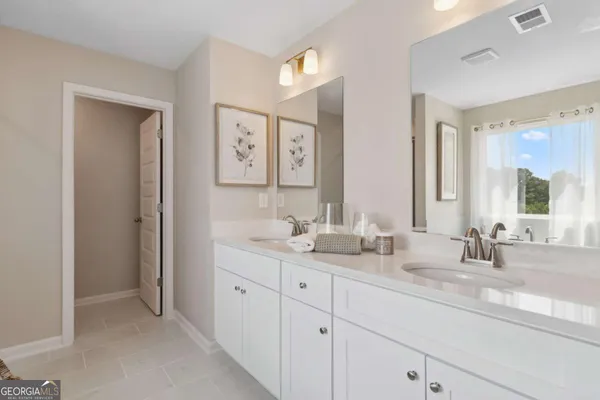 a bathroom with a tub and a sink