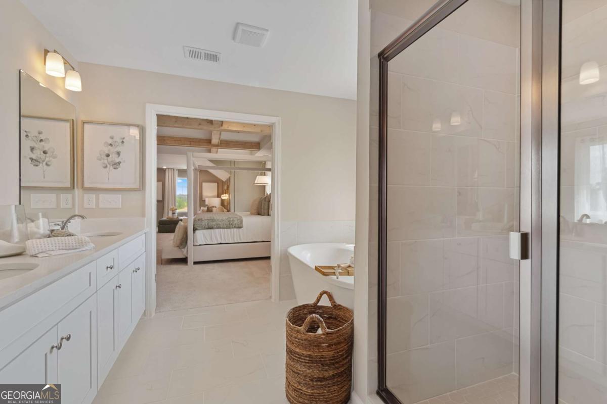 108 Compass Road Hampton, GA 30228 - Photo 45 of 51 a en suite bathroom with a sink a toilet and shower