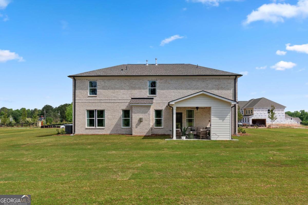 108 Compass Road Hampton, GA 30228 - Photo 46 of 51 a front view of a house with a yard