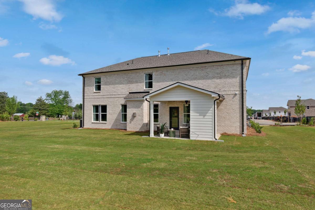 108 Compass Road Hampton, GA 30228 - Photo 47 of 51 a front view of a house with a garden
