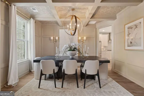 a dining room with furniture and window