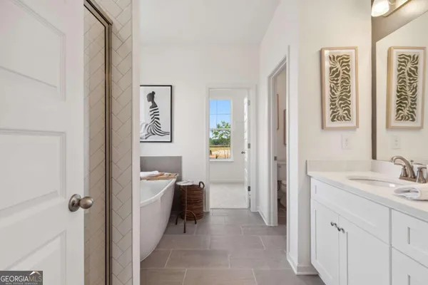 a spacious bathroom with a sink a mirror and a shower