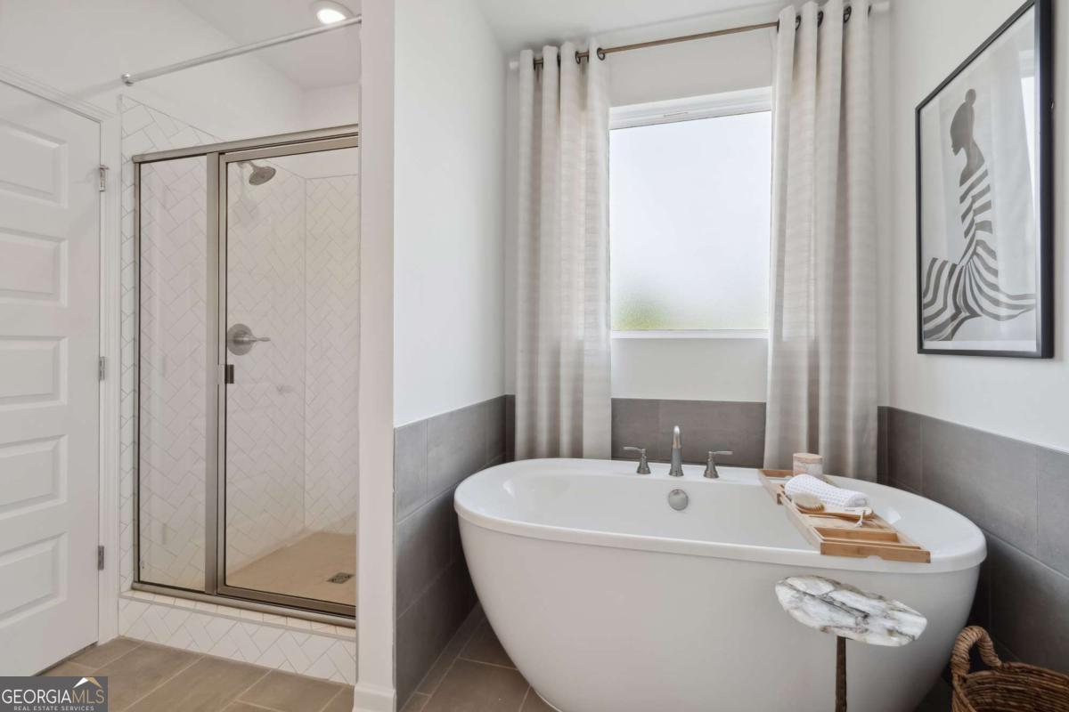 108 Compass Road Hampton, GA 30228 - Photo 10 of 51 a white bath tub sitting next to a white sink