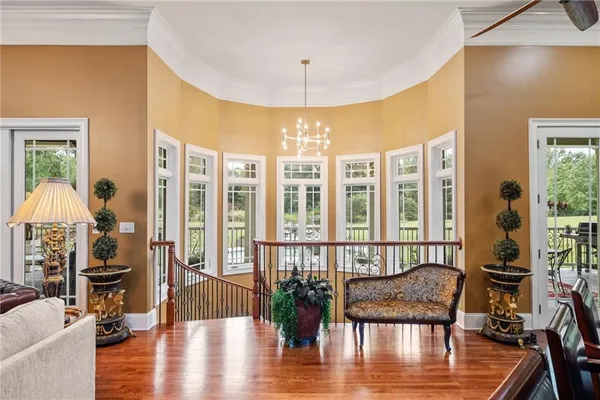 a view of a livingroom with furniture window and wooden floor