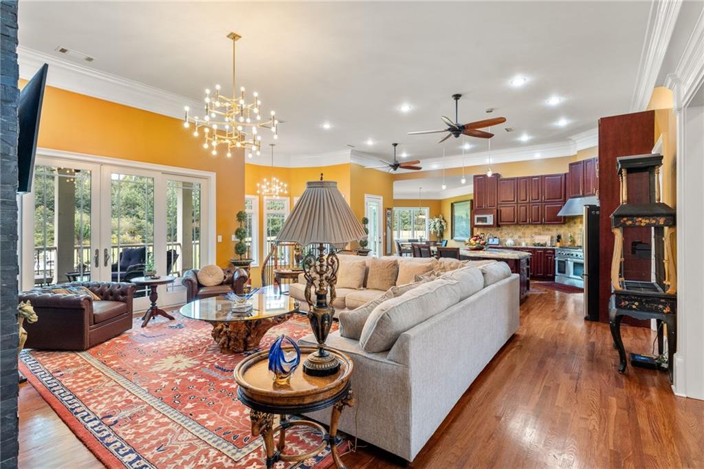 265 Honeysuckle Lane Temple, GA 30179 - Photo 2 of 5 a living room with fireplace furniture and a chandelier