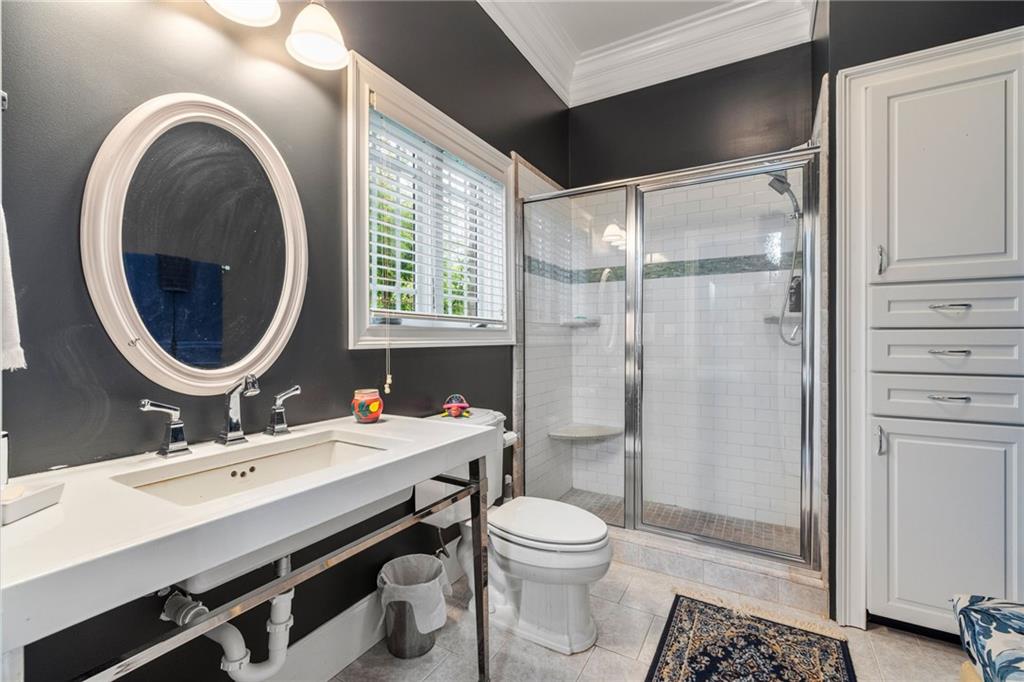 265 Honeysuckle Lane Temple, GA 30179 - Photo 24 of 45 a bathroom with a sink vanity mirror and toilet