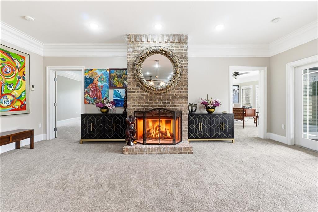 265 Honeysuckle Lane Temple, GA 30179 - Photo 27 of 45 a living room with furniture a flat screen tv and a fireplace