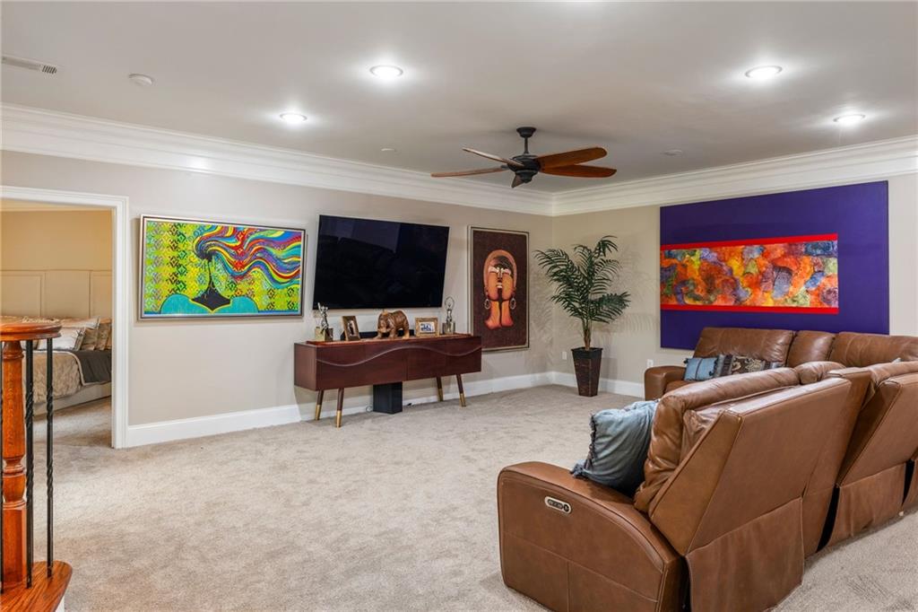 265 Honeysuckle Lane Temple, GA 30179 - Photo 29 of 45 a living room with furniture and a flat screen tv
