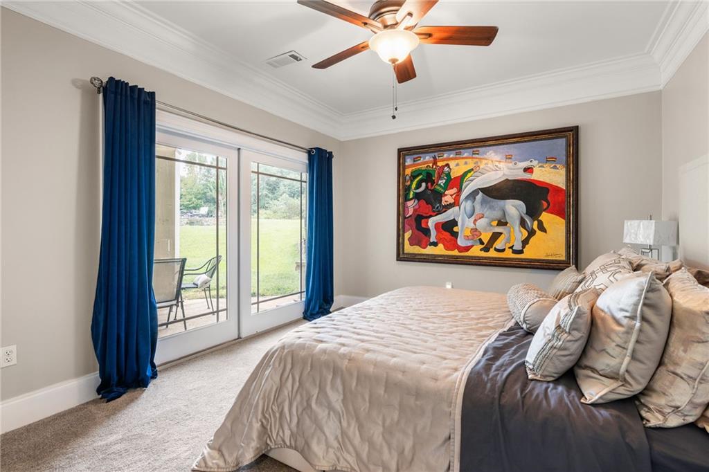265 Honeysuckle Lane Temple, GA 30179 - Photo 32 of 45 a bedroom with a bed and a painting on the wall