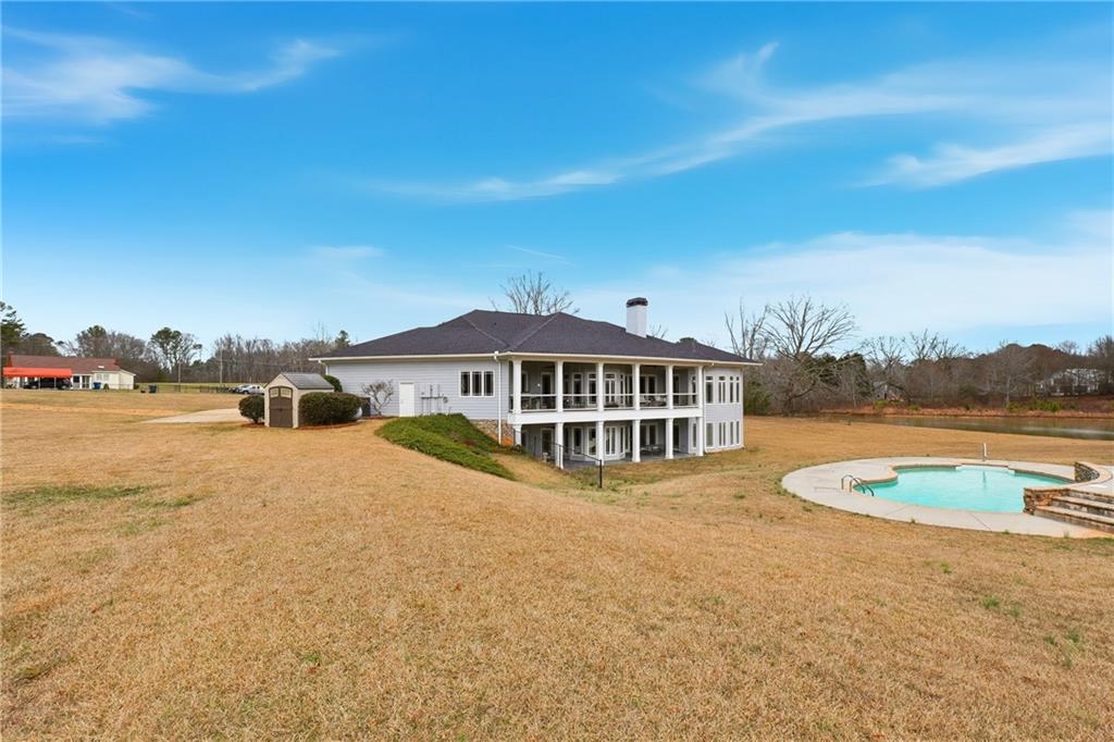 265 Honeysuckle Lane Temple, GA 30179 - Photo 45 of 45 a view of a house with swimming pool and sitting area