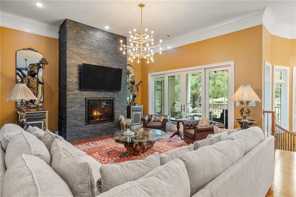 265 Honeysuckle Lane Temple, GA 30179 - Photo 8 of 45 a living room with furniture a fireplace and a flat screen tv