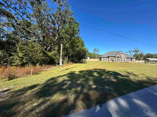 a view of an ocean with trees