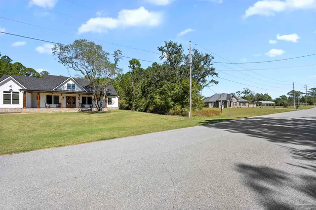 a view of house with outdoor space and street view