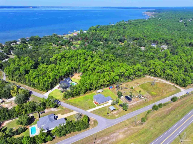 a view of a large body of water with a building in the background