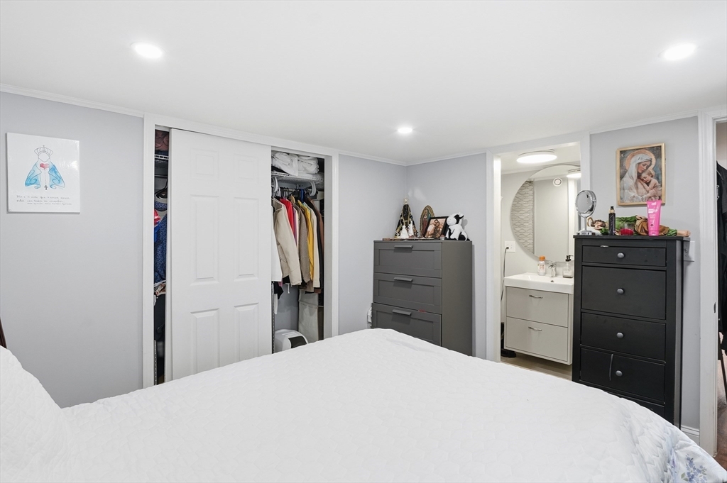 165 Turnpike Road, Unit 7 Westborough, MA 01581 - Photo 12 of 19 a bedroom with a bed and a dresser