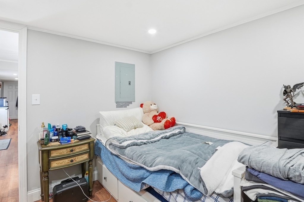 165 Turnpike Road, Unit 7 Westborough, MA 01581 - Photo 16 of 19 a bedroom with a bed and a furniture