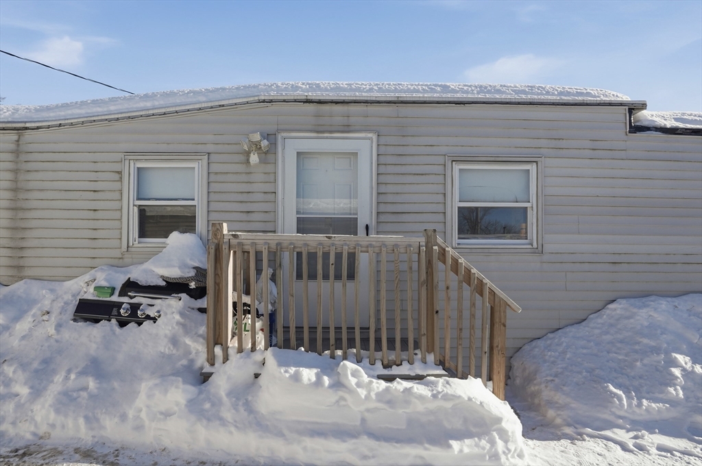165 Turnpike Road, Unit 7 Westborough, MA 01581 - Photo 18 of 19 a view of a house with a wooden fence