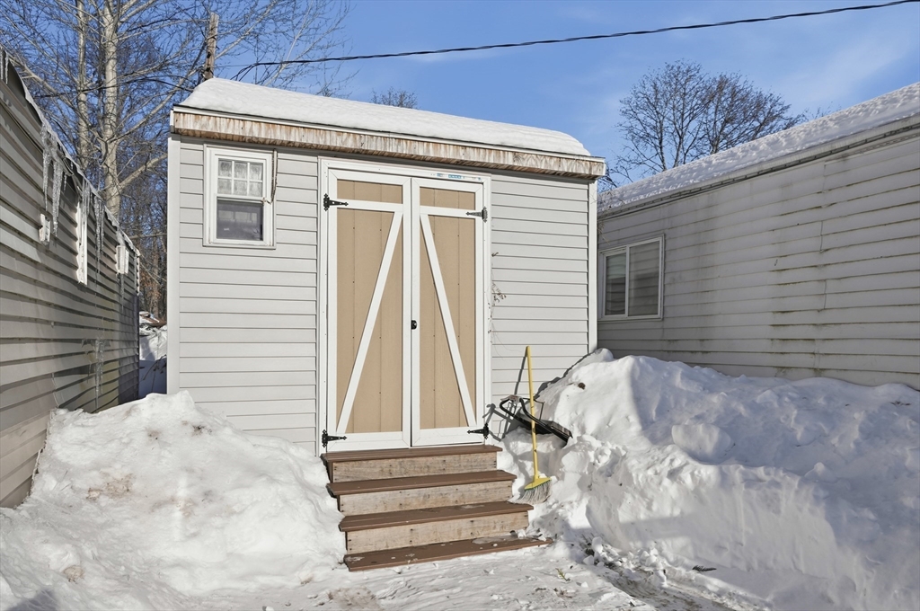 165 Turnpike Road, Unit 7 Westborough, MA 01581 - Photo 19 of 19 a view of wooden house with a small yard