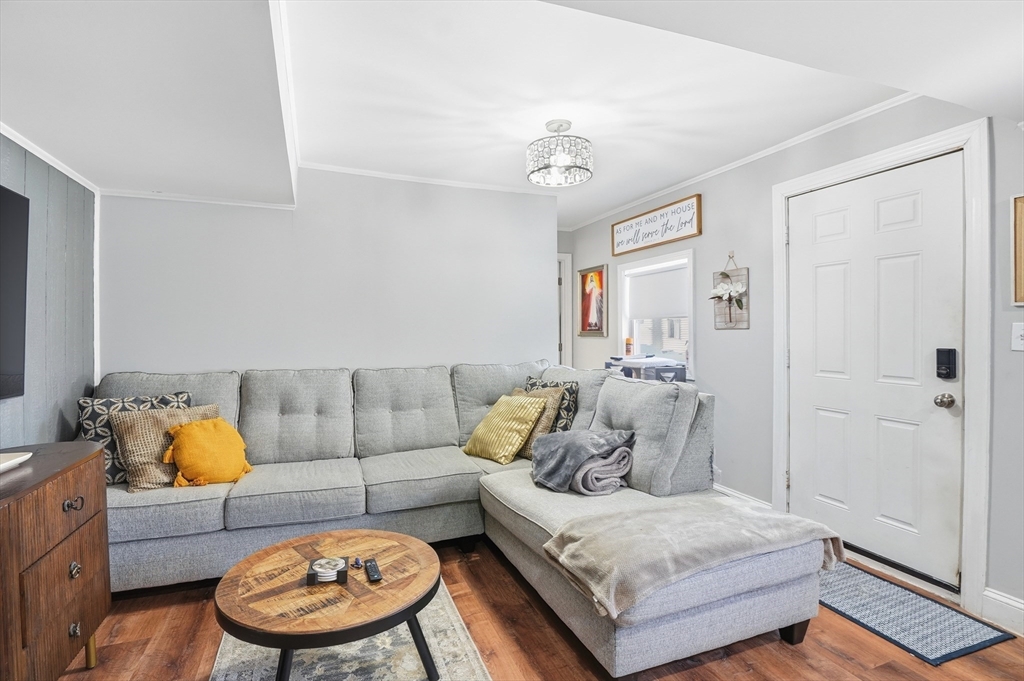 165 Turnpike Road, Unit 7 Westborough, MA 01581 - Photo 4 of 19 a living room with furniture and a couch