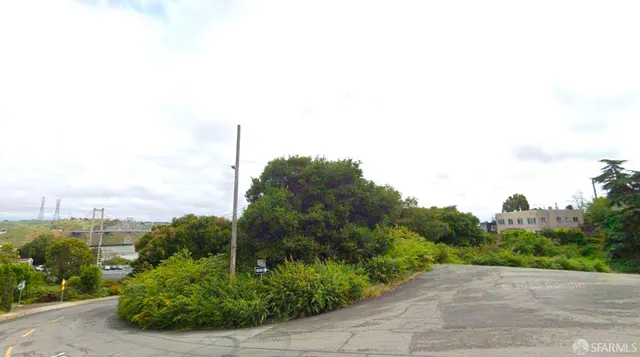 a view of a street with a building in the background