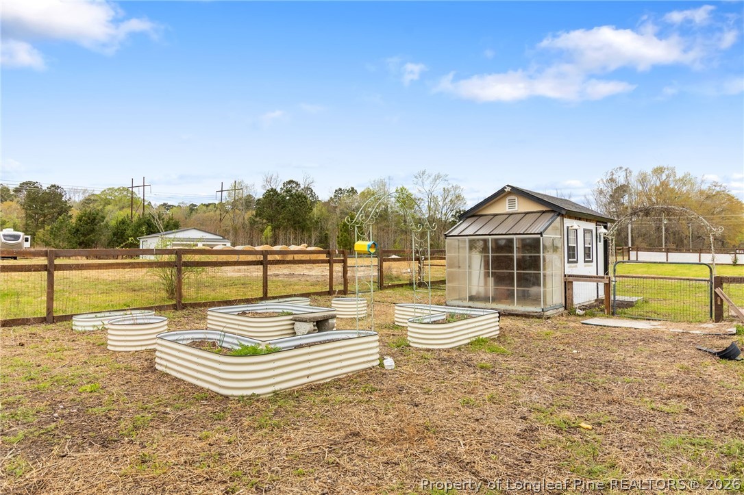 5535 Butler Nursery Road Fayetteville, NC 28306 - Photo 45 of 50 a view of swimming pool with outdoor seating and yard in the back