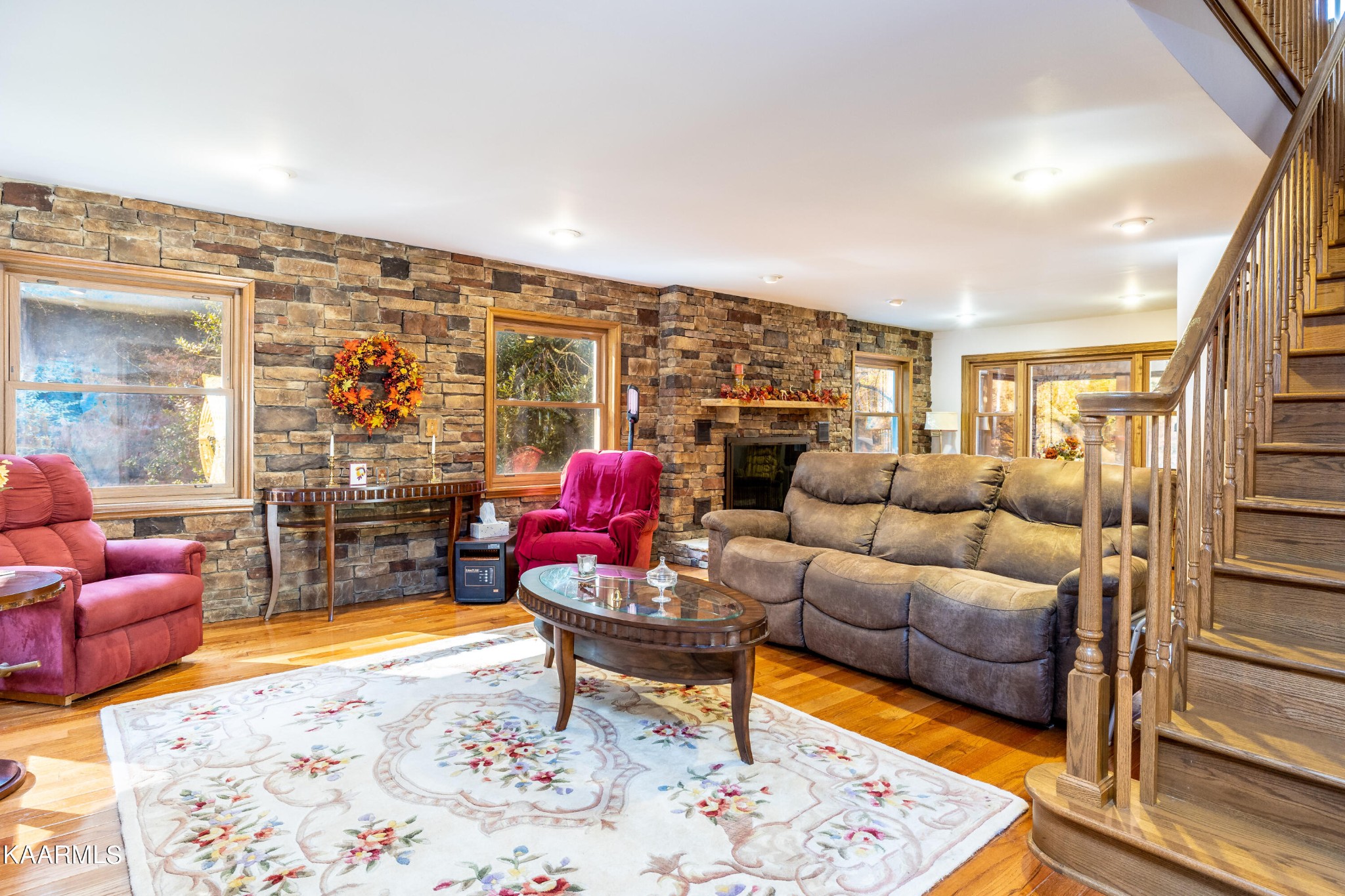 710 Scenic River Road Madisonville, TN 37354 - Photo 12 of 43 a living room with furniture a rug and a floor to ceiling window