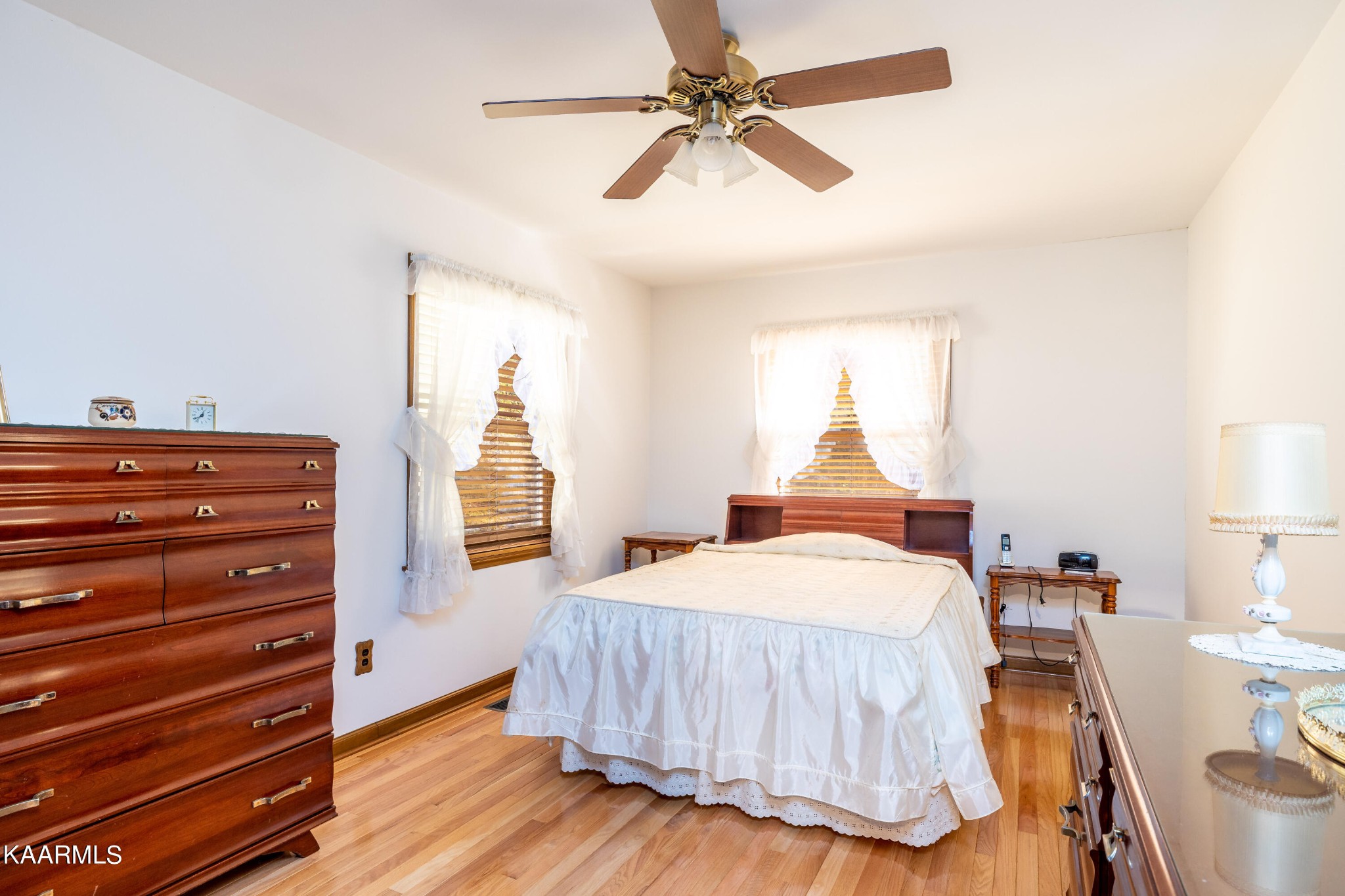 710 Scenic River Road Madisonville, TN 37354 - Photo 16 of 43 a bedroom with a bed and wooden floor