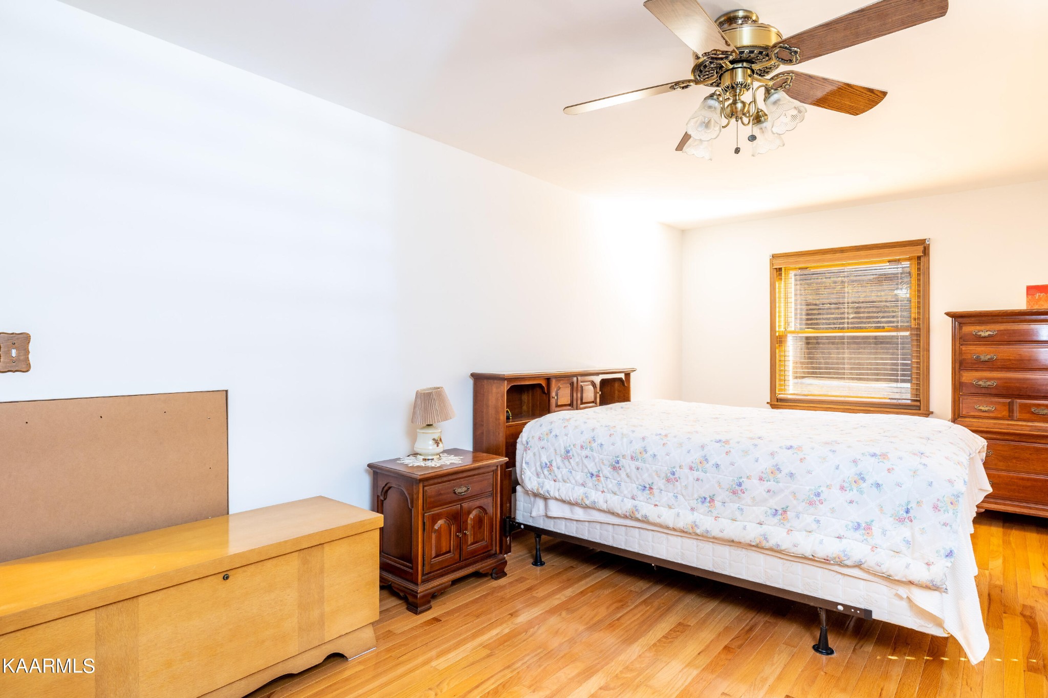 710 Scenic River Road Madisonville, TN 37354 - Photo 18 of 43 a bedroom with a bed and a chandelier
