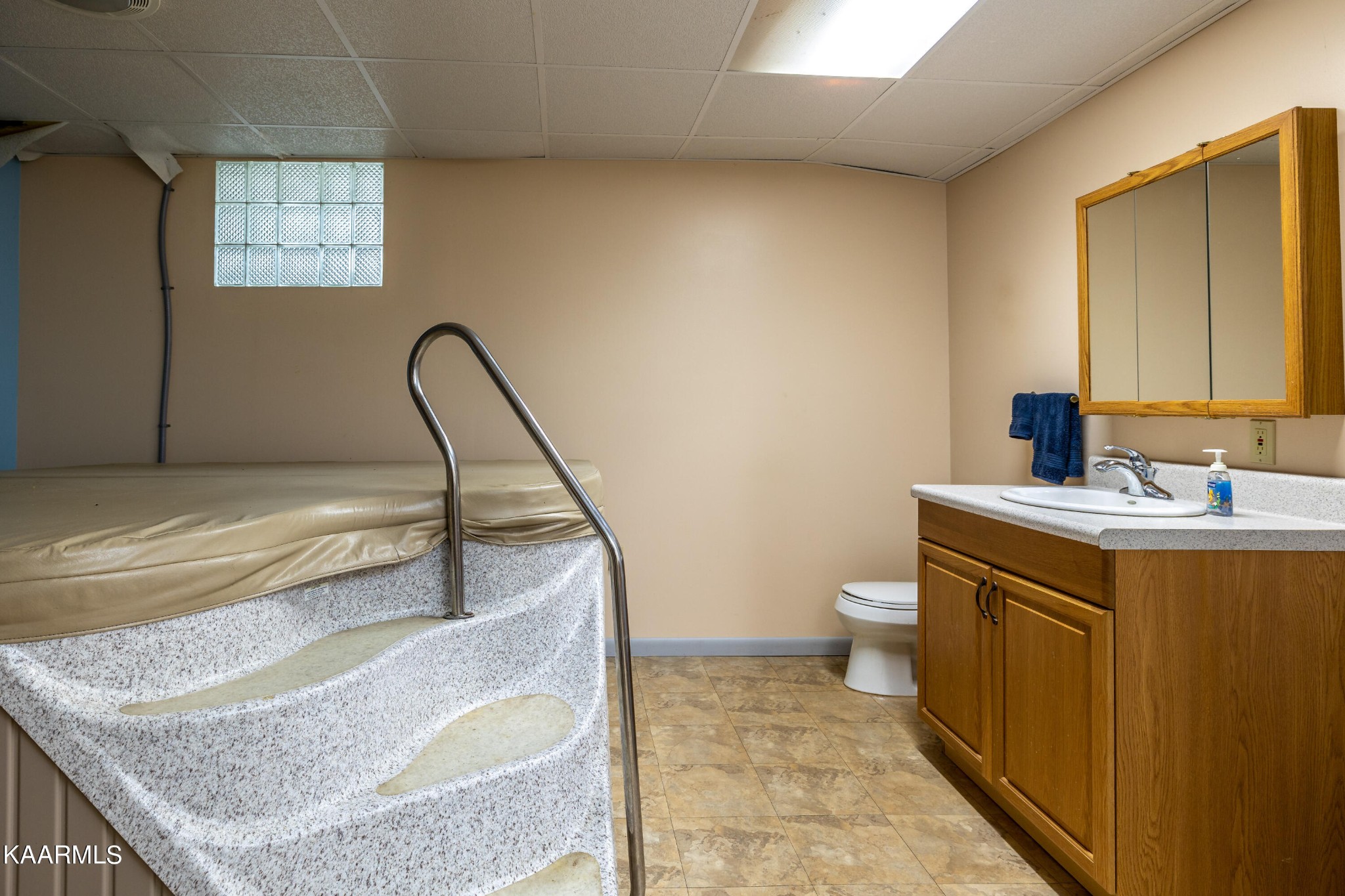 710 Scenic River Road Madisonville, TN 37354 - Photo 26 of 43 a bathroom with a granite countertop sink a toilet and a bathtub