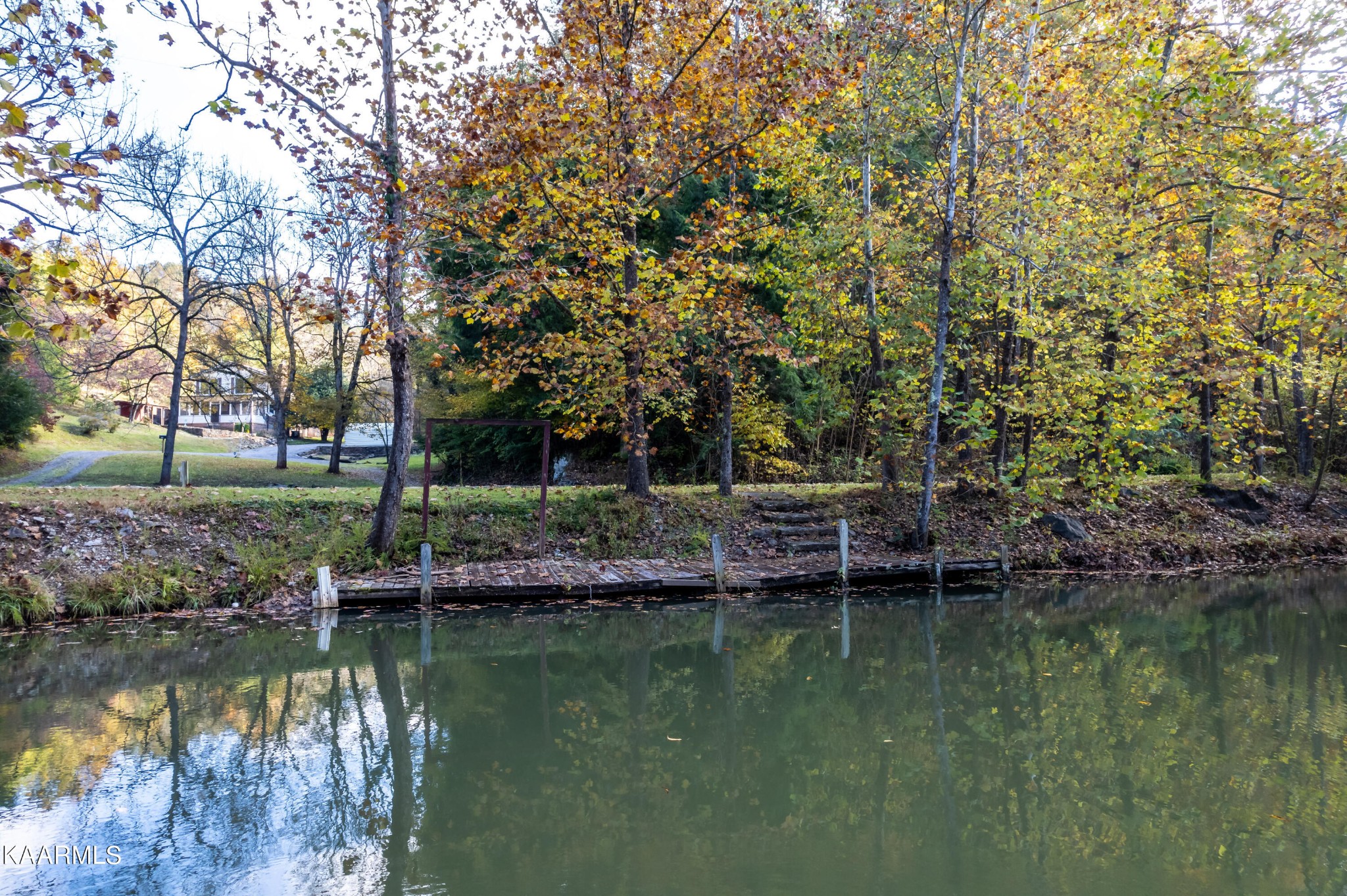 710 Scenic River Road Madisonville, TN 37354 - Photo 3 of 43 a view of a lake with houses with yard and lake