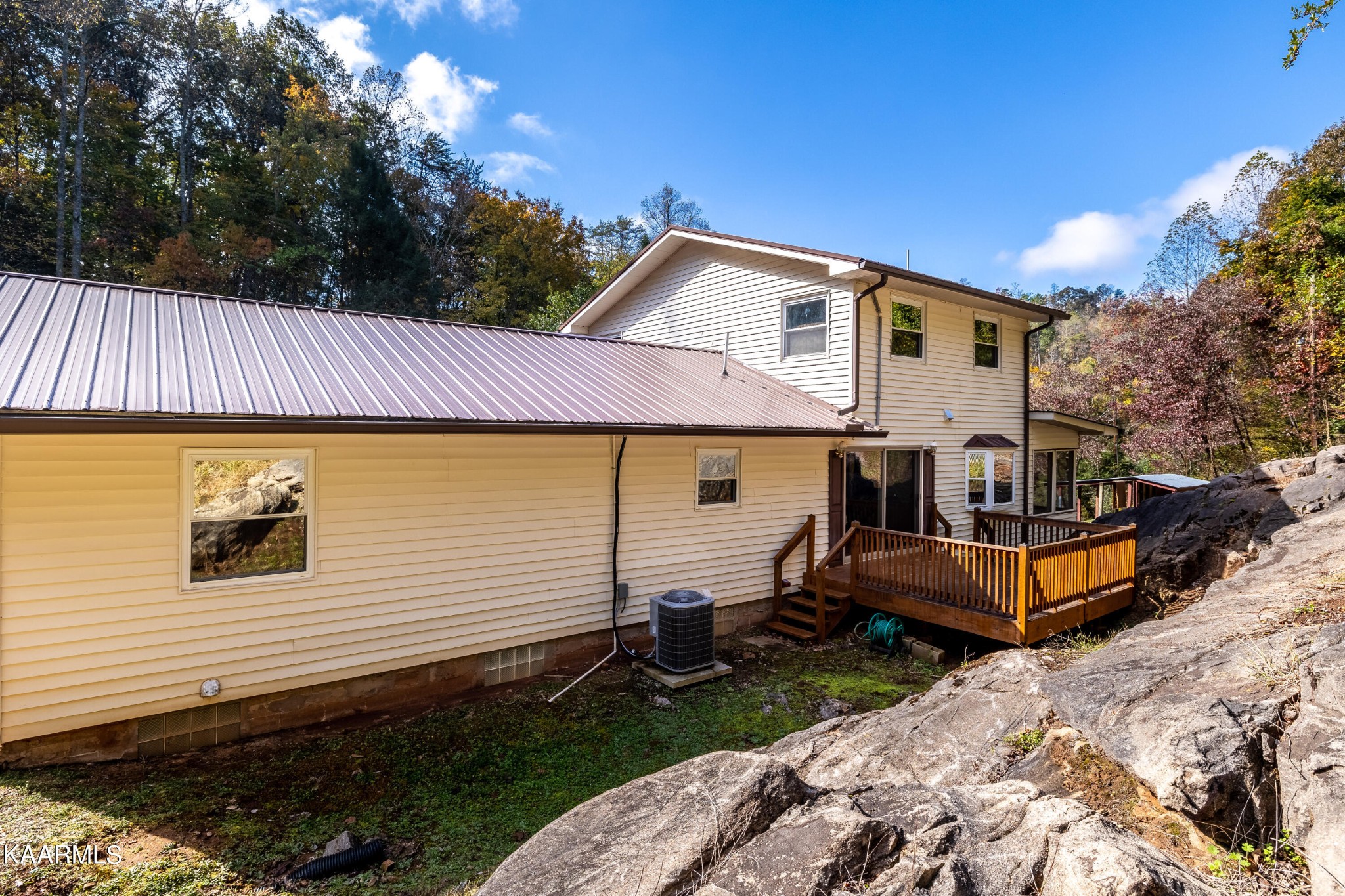 710 Scenic River Road Madisonville, TN 37354 - Photo 31 of 43 a view of a house with backyard and sitting area