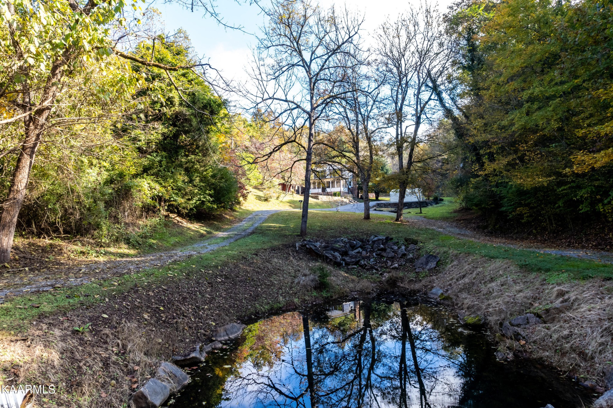710 Scenic River Road Madisonville, TN 37354 - Photo 4 of 43 a view of backyard with green space and seating