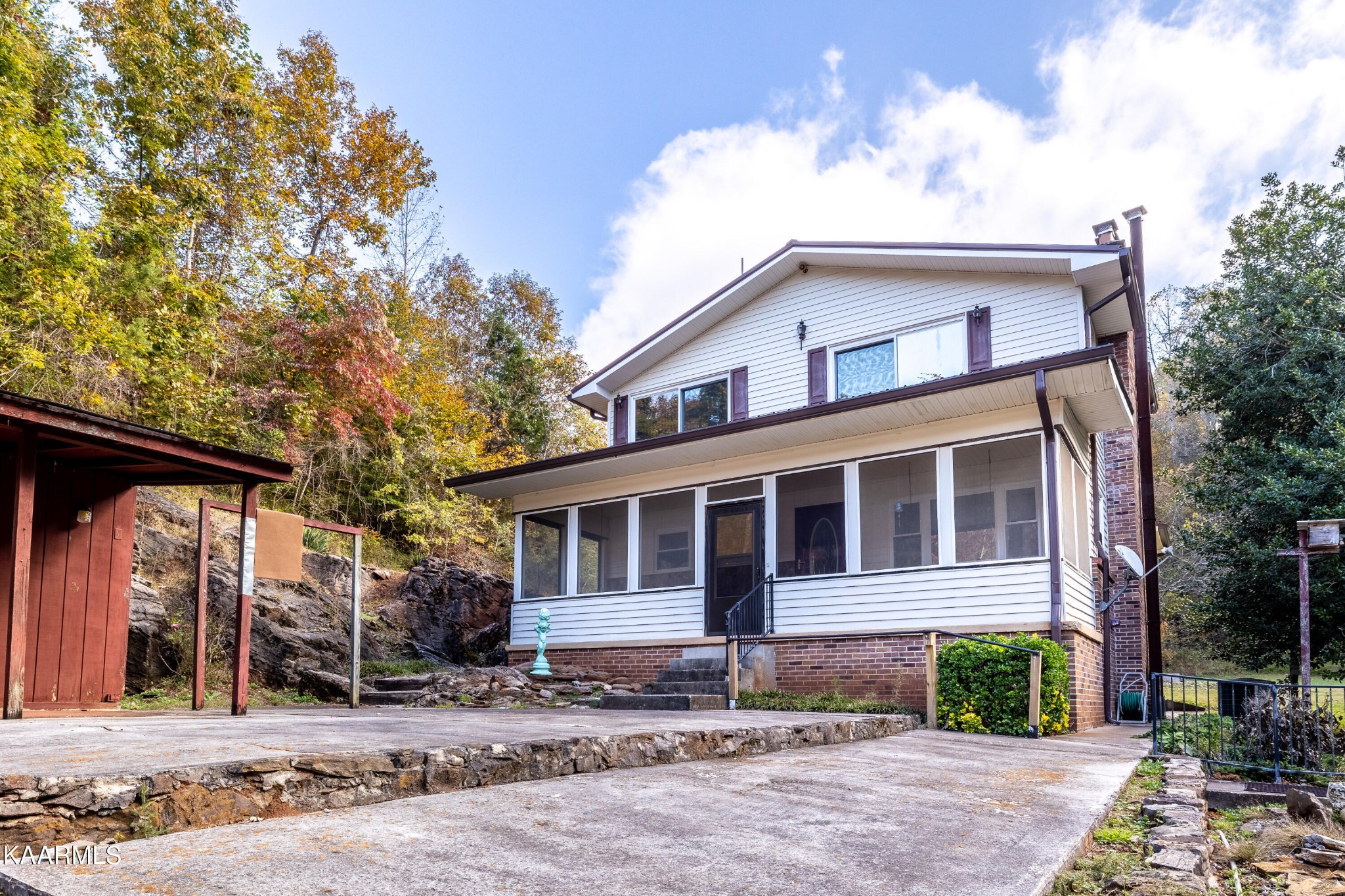 710 Scenic River Road Madisonville, TN 37354 - Photo 6 of 43 a front view of a house with a yard