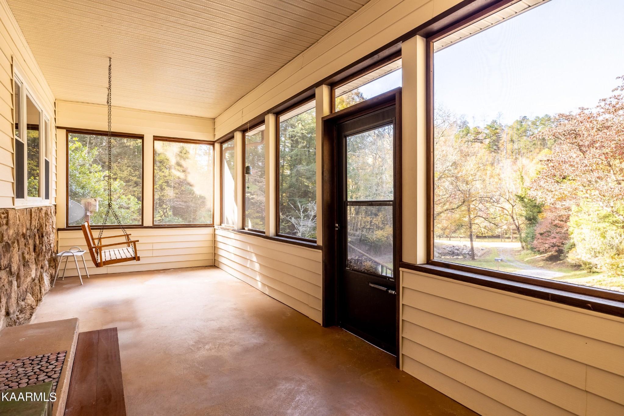 710 Scenic River Road Madisonville, TN 37354 - Photo 7 of 43 a view of an empty room with wooden floor and a window