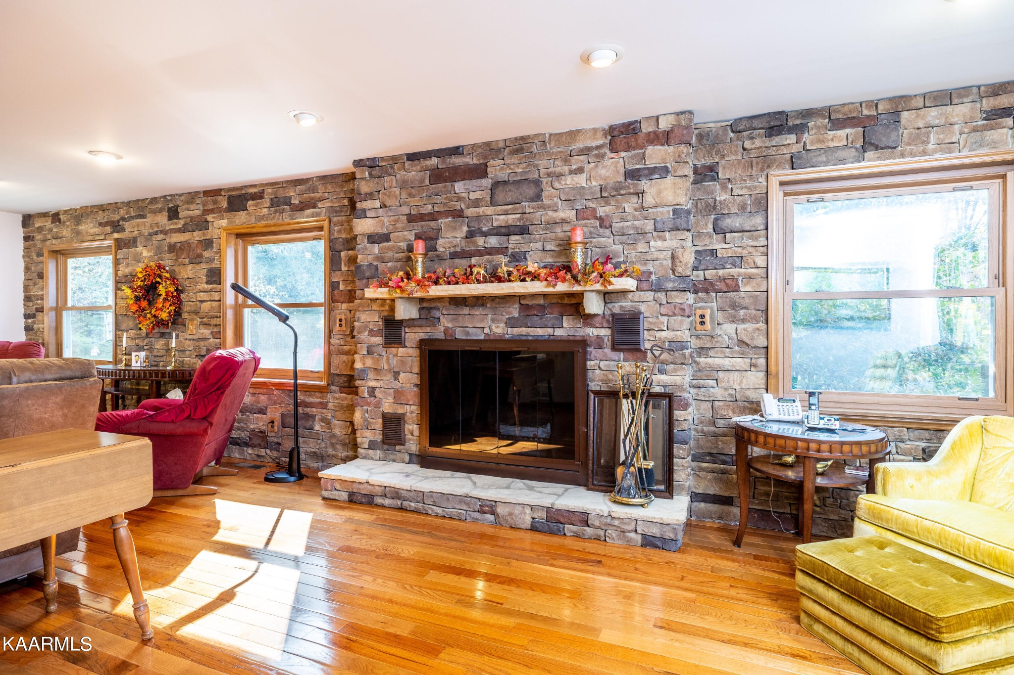 710 Scenic River Road Madisonville, TN 37354 - Photo 9 of 43 a living room with furniture a fireplace and a floor to ceiling window