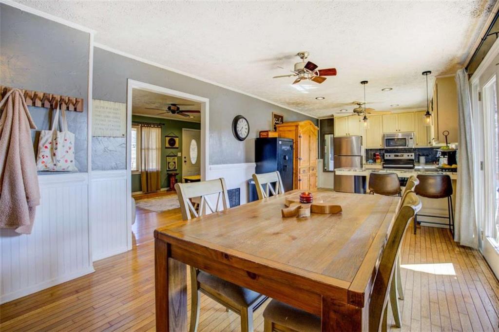 40 Spillers Lane Covington, GA 30014 - Photo 12 of 42 a view of a dining room with furniture and wooden floor