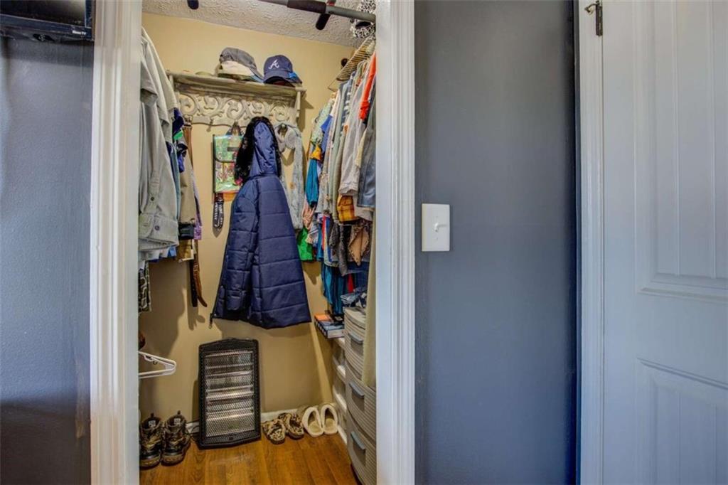 40 Spillers Lane Covington, GA 30014 - Photo 20 of 42 a view of walk in closet with clothes