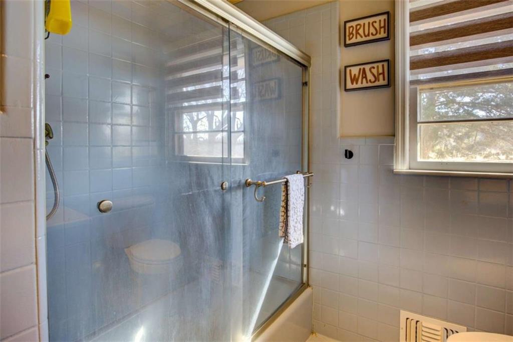 40 Spillers Lane Covington, GA 30014 - Photo 24 of 42 a bathroom with a shower and a sink