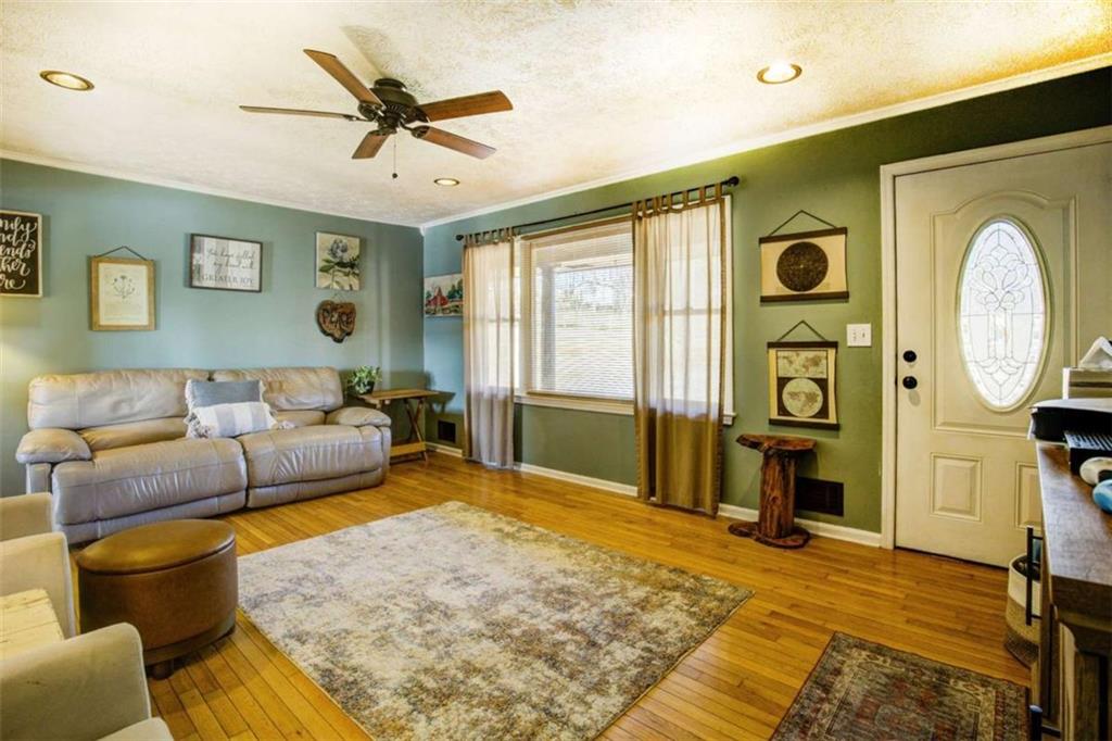 40 Spillers Lane Covington, GA 30014 - Photo 6 of 42 a living room with furniture and a large window