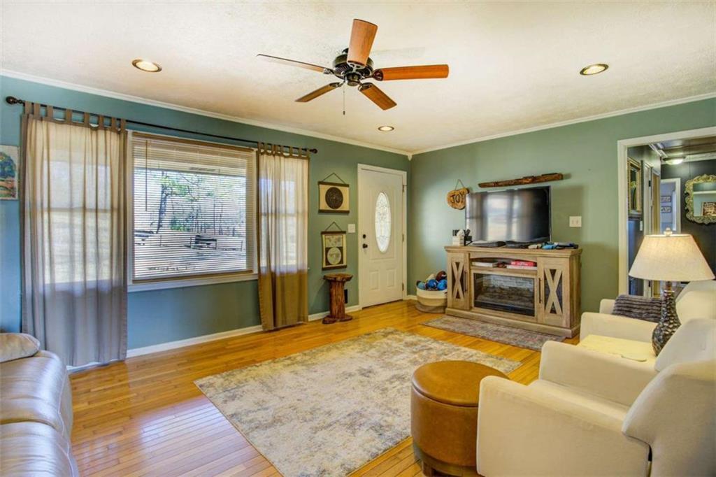 40 Spillers Lane Covington, GA 30014 - Photo 7 of 42 a living room with furniture and a flat screen tv