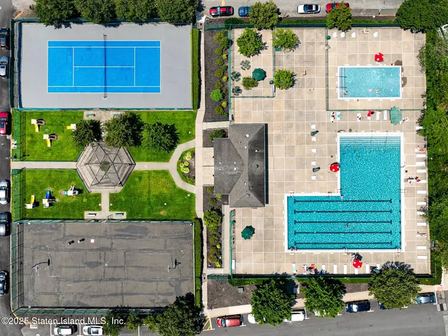 an aerial view of house with pool