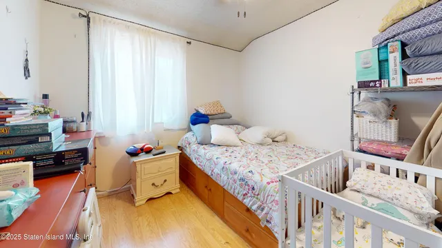 a bedroom with furniture and a window