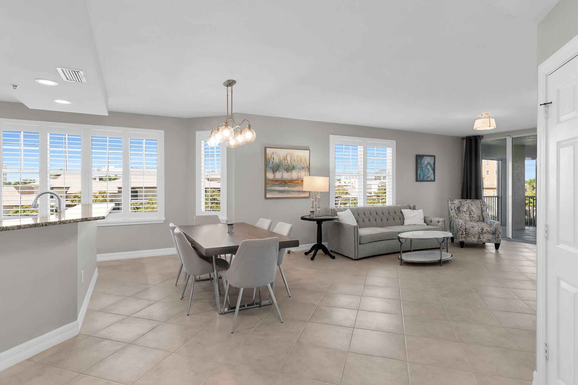 1111 Swallow Avenue, Unit 1401 Marco Island, FL 34145 - Photo 12 of 36 a living room with furniture and a large window